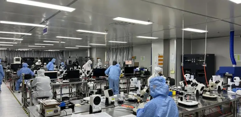 Precision laser source production line with microscope workstations