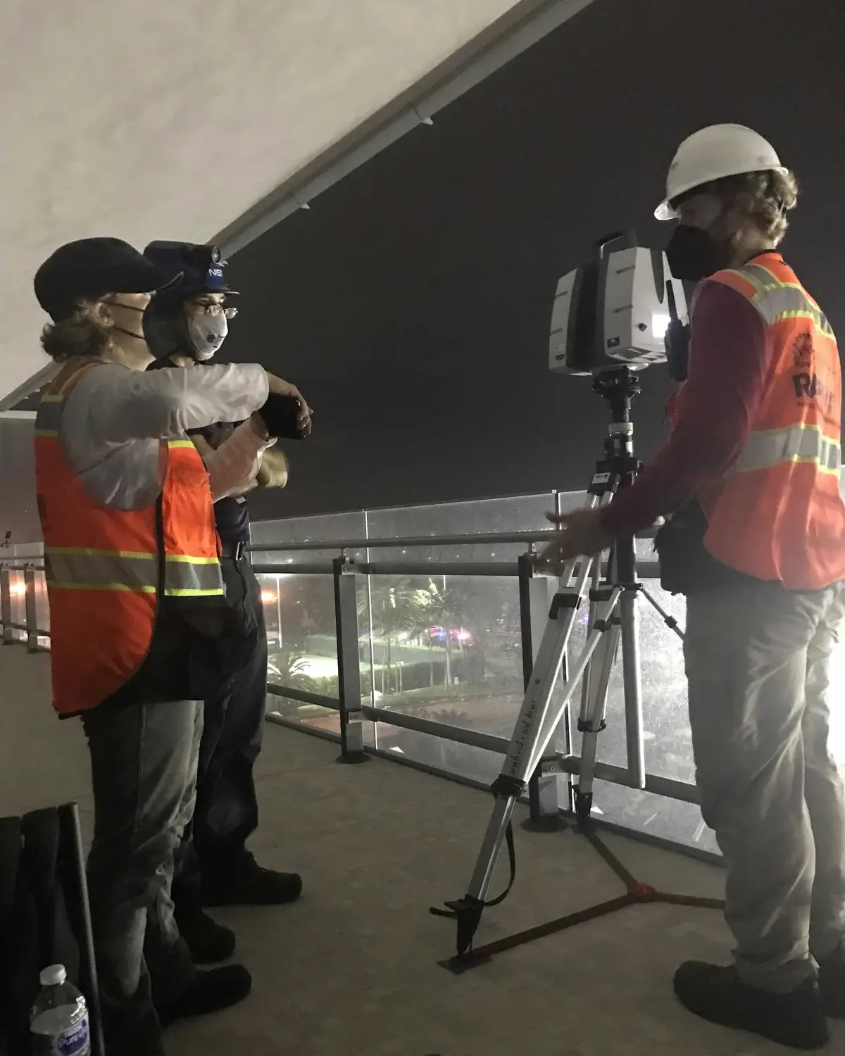 Engineers operating a terrestrial LiDAR scanner during infrastructure inspection
