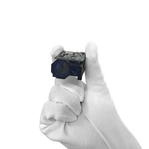 Compact 3 km-class 1535 nm laser rangefinder module held between gloved fingers