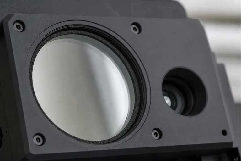 Conceptual protective optical window and adjacent aperture in a neutral instrument bezel